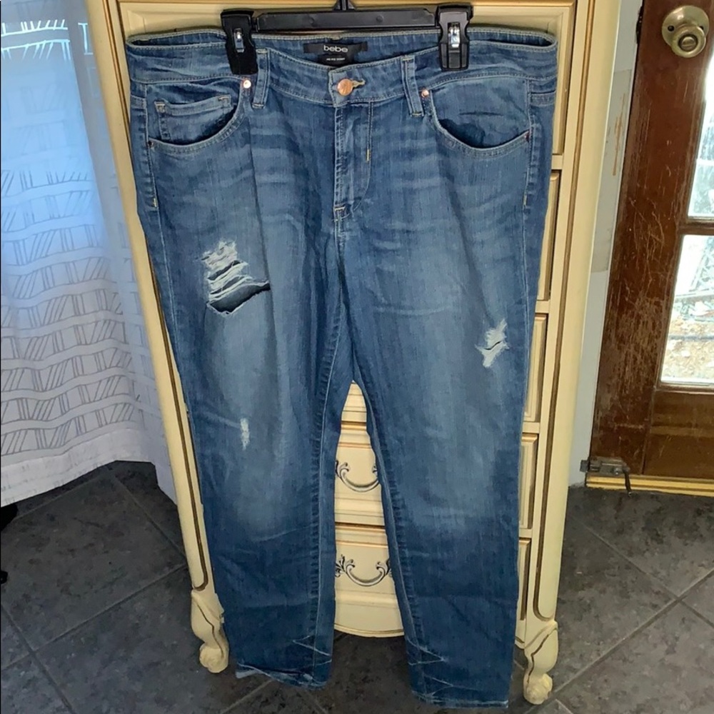 Bebe mid rise distressed skinny jeans